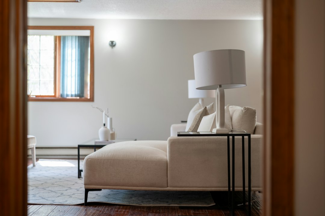 Modern living room with white sectional sofa and lamps