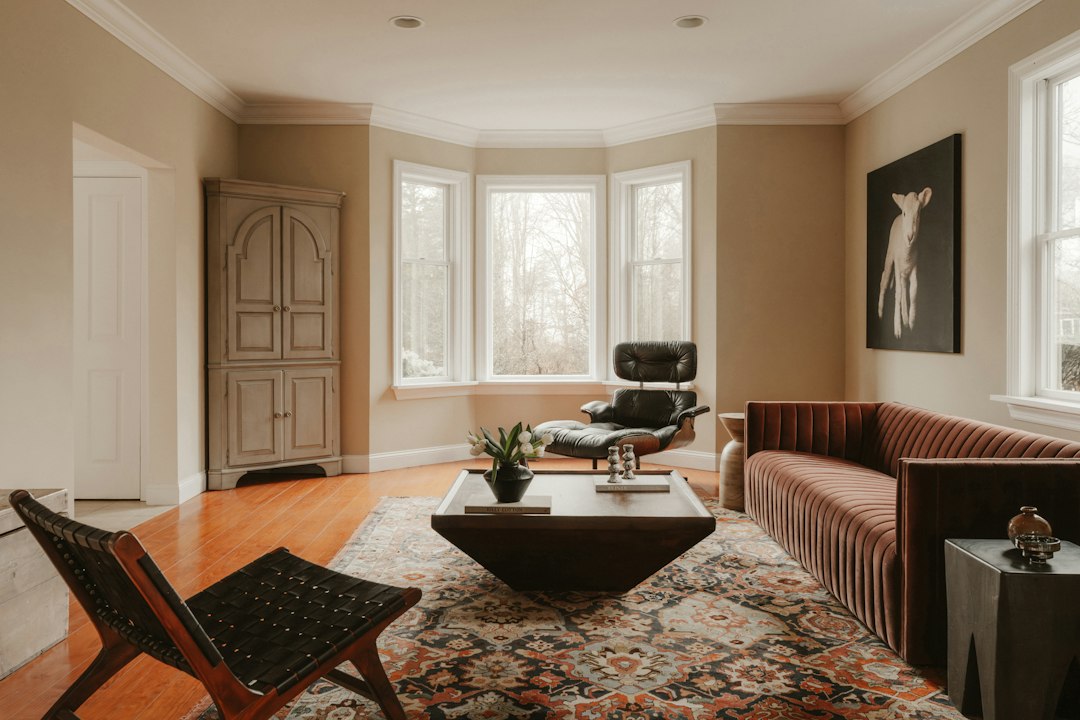 Modern living room with stylish furniture and large windows