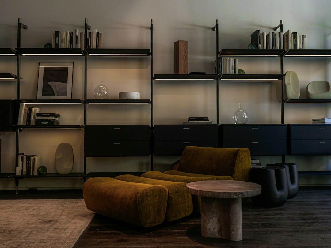 Modern living room with modular shelves and mustard armchair