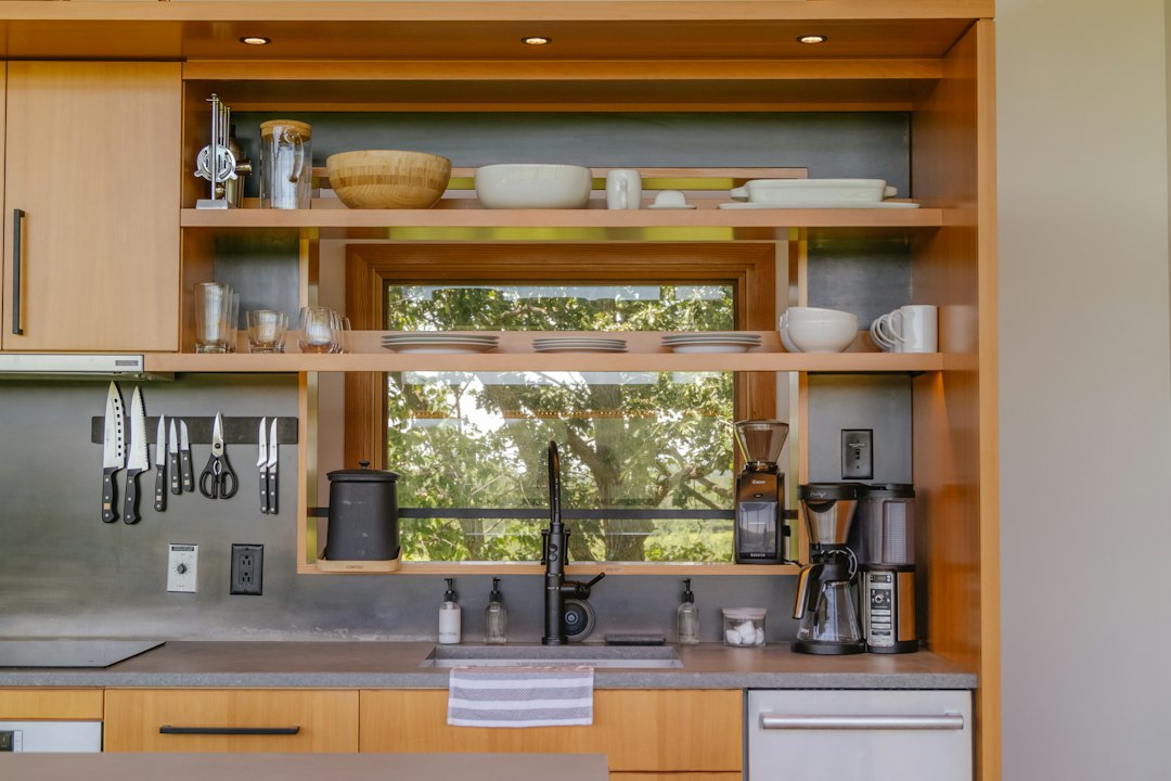 a kitchen with a sink and a mirror